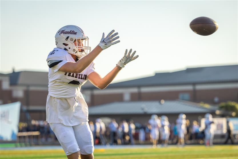Student-athletes play football